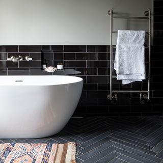 contemporary bathroom with black wall tiles
