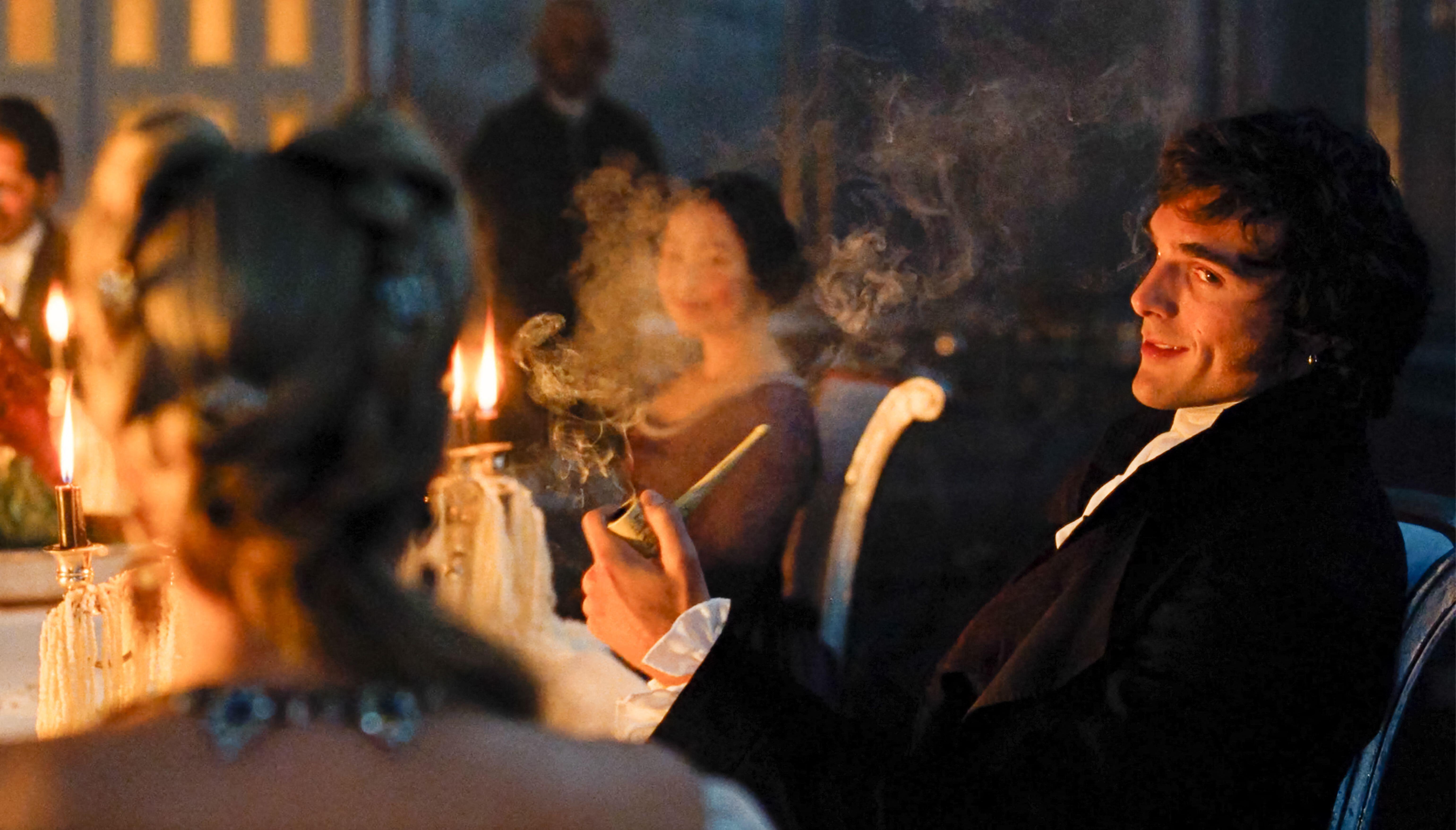 Jacob Elordi smoking a pipe in Wuthering Heights