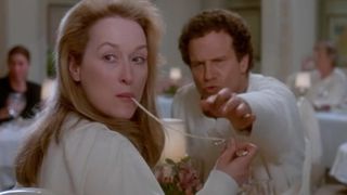 Meryl Streep eats spaghetti with a noodle hanging from her mouth in Defending Your Life
