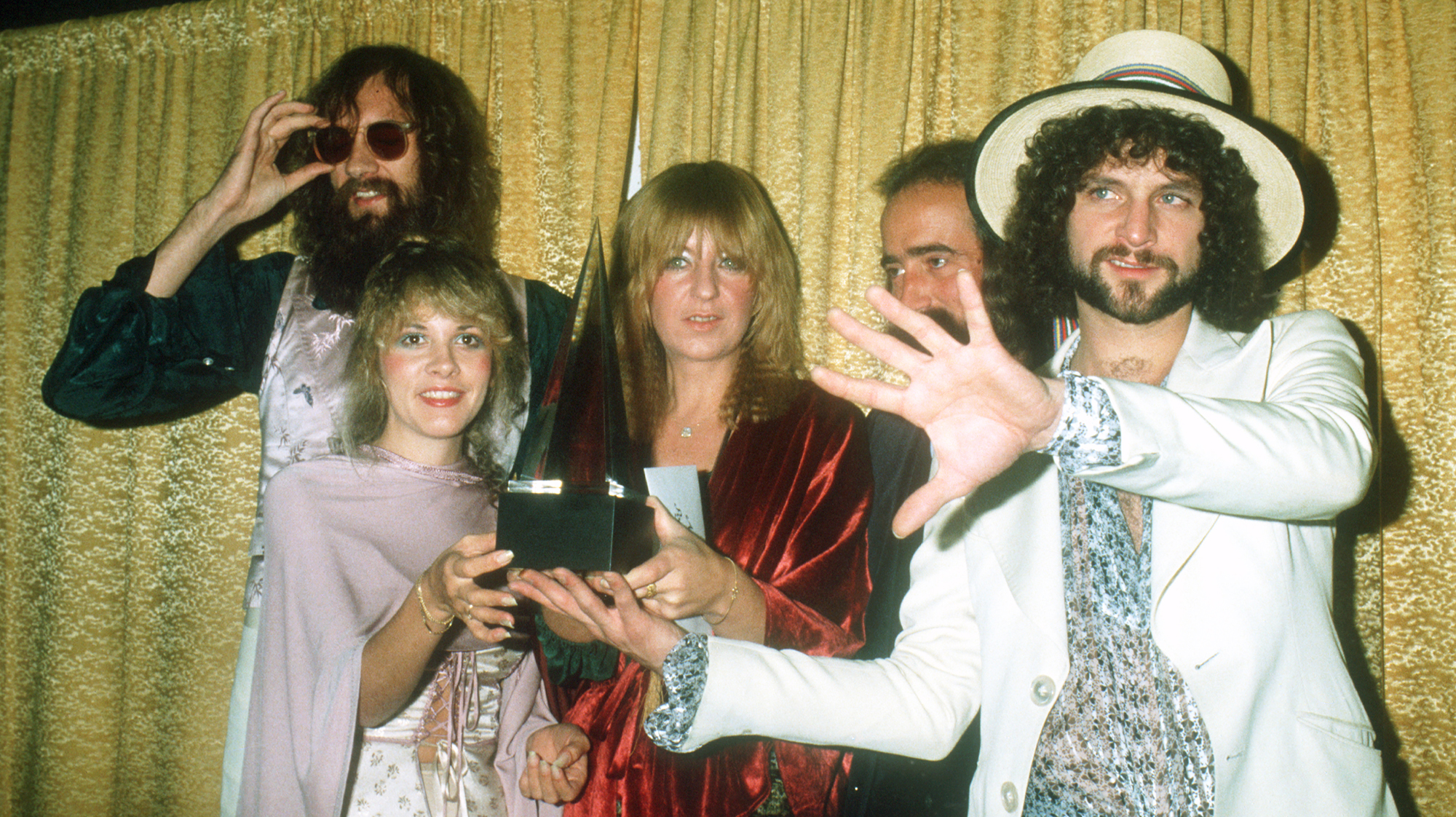 Fleetwood Mac (L-R Mick Fleetwood, Stevie Nicks, Christine McVie, John McVie and Lindsey Buckingham) pose for photographers backstage at the 5th American music Awards held at the Santa Monica Civic Auditorium on January 16, 1978 in Santa Monica