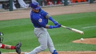 Cubs Javier Baez takes a swing at the plate.