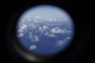 A Royal New Zealand Air Force P-3K2 Orion aircraft searches for missing Malaysian Airlines flight MH370 on March 29, 2014 over the southern Indian Ocean.