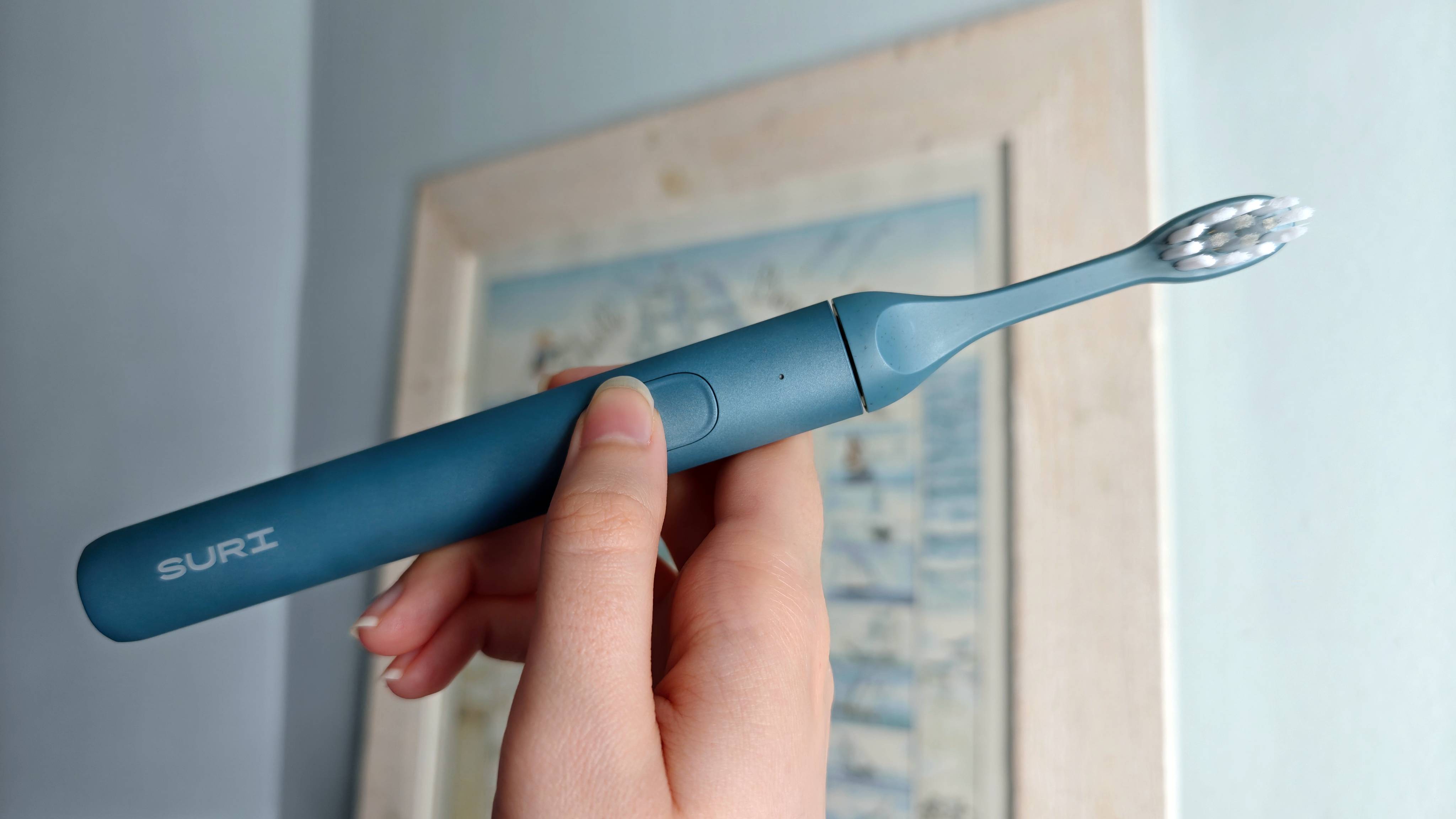 Suri 2.0 Electric Toothbrush in hand