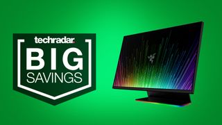 Razer Raptor 27 gaming monitor on a green background beside a TechRadar 'BIG SAVINGS' badge.