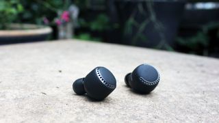 black wireless earbuds