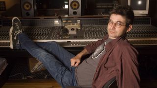 Steve Albini with his feet up on a mixing desk