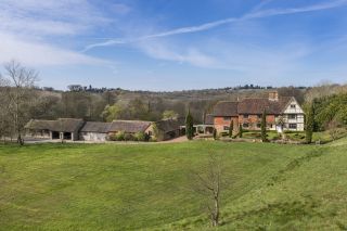 Barelands, Bells Yew Green, East Sussex. Idyllic Grade II-listed farmhouse with eight bedrooms, stables, a pond, a swimming pool and fields. £2.5 million through Savills.