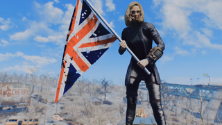 A character waves a British flag in the Wasteland in Fallout: London.