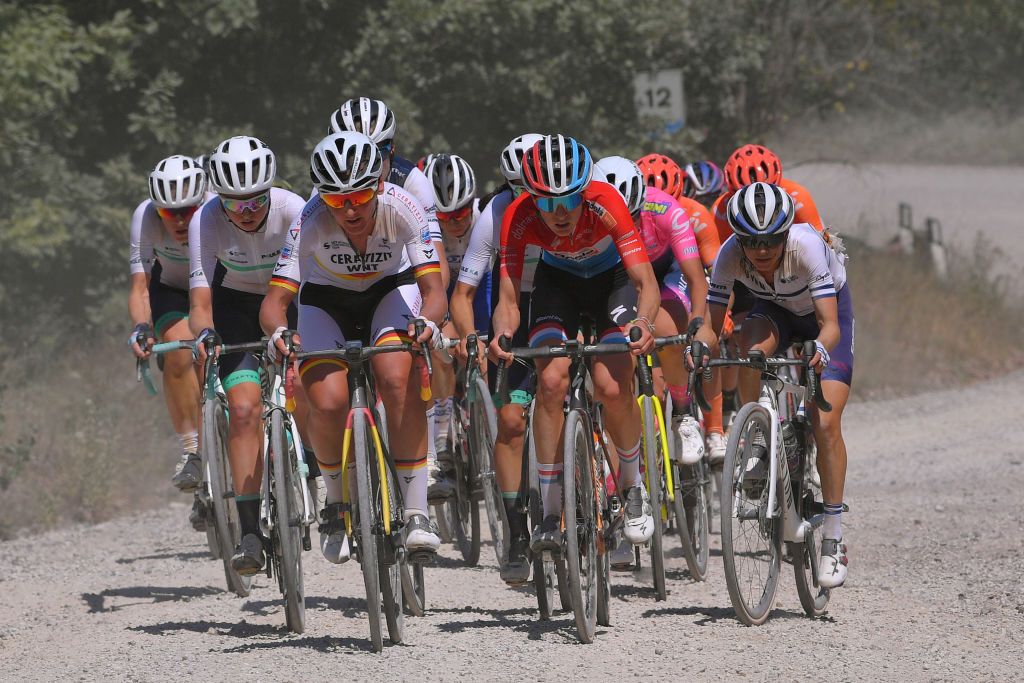SIENA ITALY AUGUST 01 Lisa Brennauer of Germany and Ceratizit WNT Pro Cycling Team Christine Majerus of Luxembourg and Boels Dolmans Cyclingteam Omer Shapira of Israel and Team CanyonSram Racing Dust during the Eroica 6th Strade Bianche 2020 Women Elite a 136km race from Siena to Siena Piazza del Campo StradeBianche on August 01 2020 in Siena Italy Photo by Luc ClaessenGetty Images