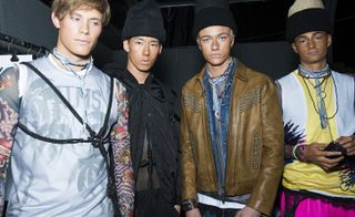 Four male models wearing Dsquared2 collection