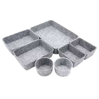 A 7-piece set of felt drawer organizers including rectangular and circular containers