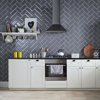 kitchen with herringbone pattern metro tiles