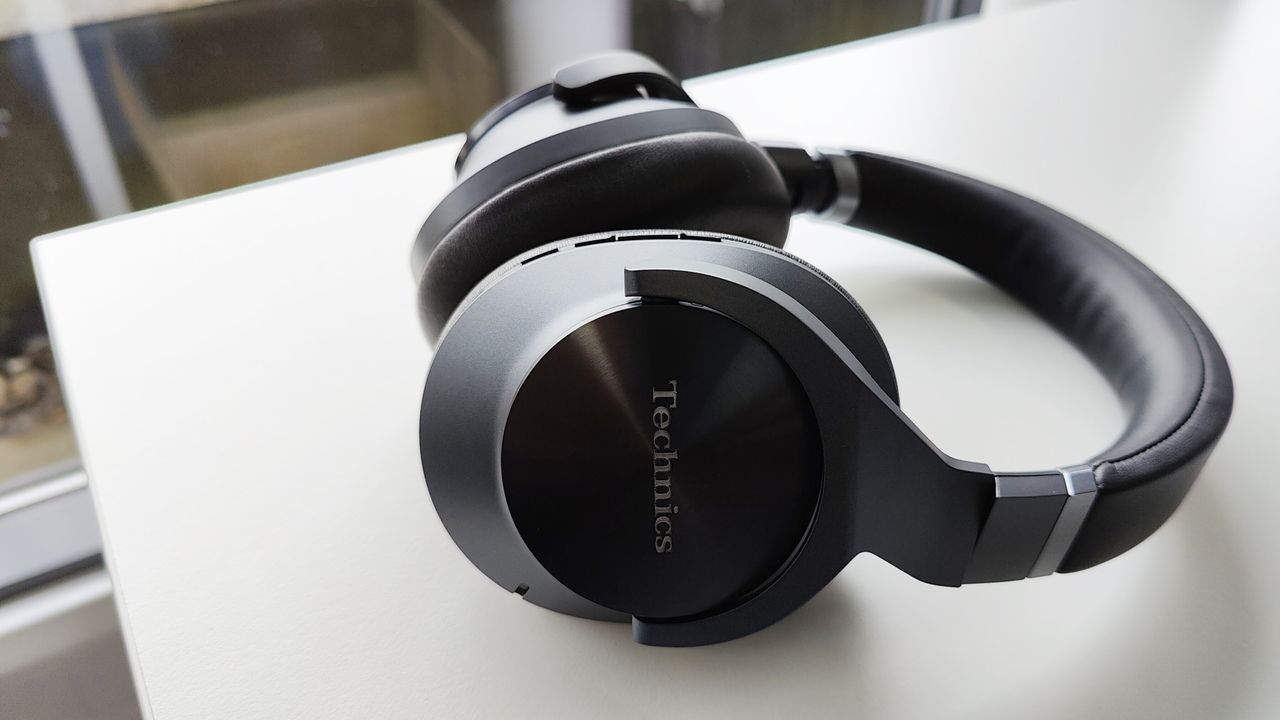 Technics EAH-A800 review: black headphones on a white desk by a window