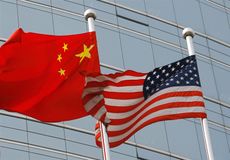 Chinese and American flags wave in Beijing