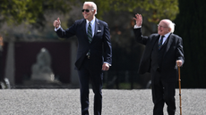 Joe Biden walks alongside Michael D. Higgins