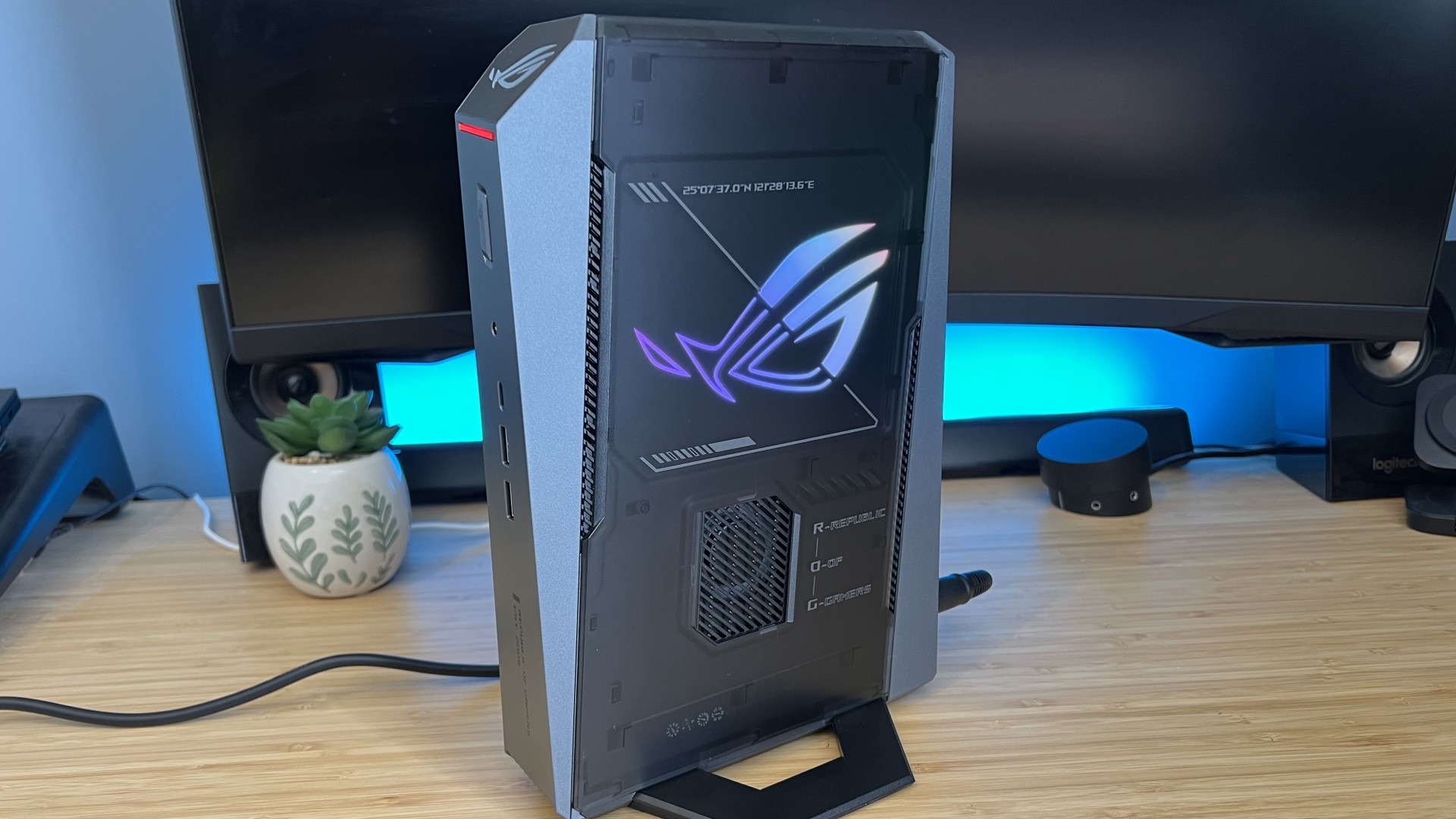 Asus ROG NUC mini PC on a wooden desk