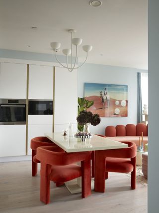 open plan dining living with red velvet dining chairs