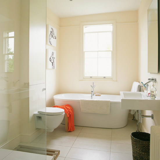 bathroom with bathtub and glass partition