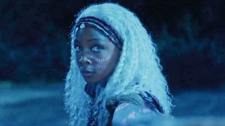 Zelie (Mbedu) , a woman with the power to command undead spirits in her homeland, the kingdom of Orisha, Children of Blood and Bone (2027).