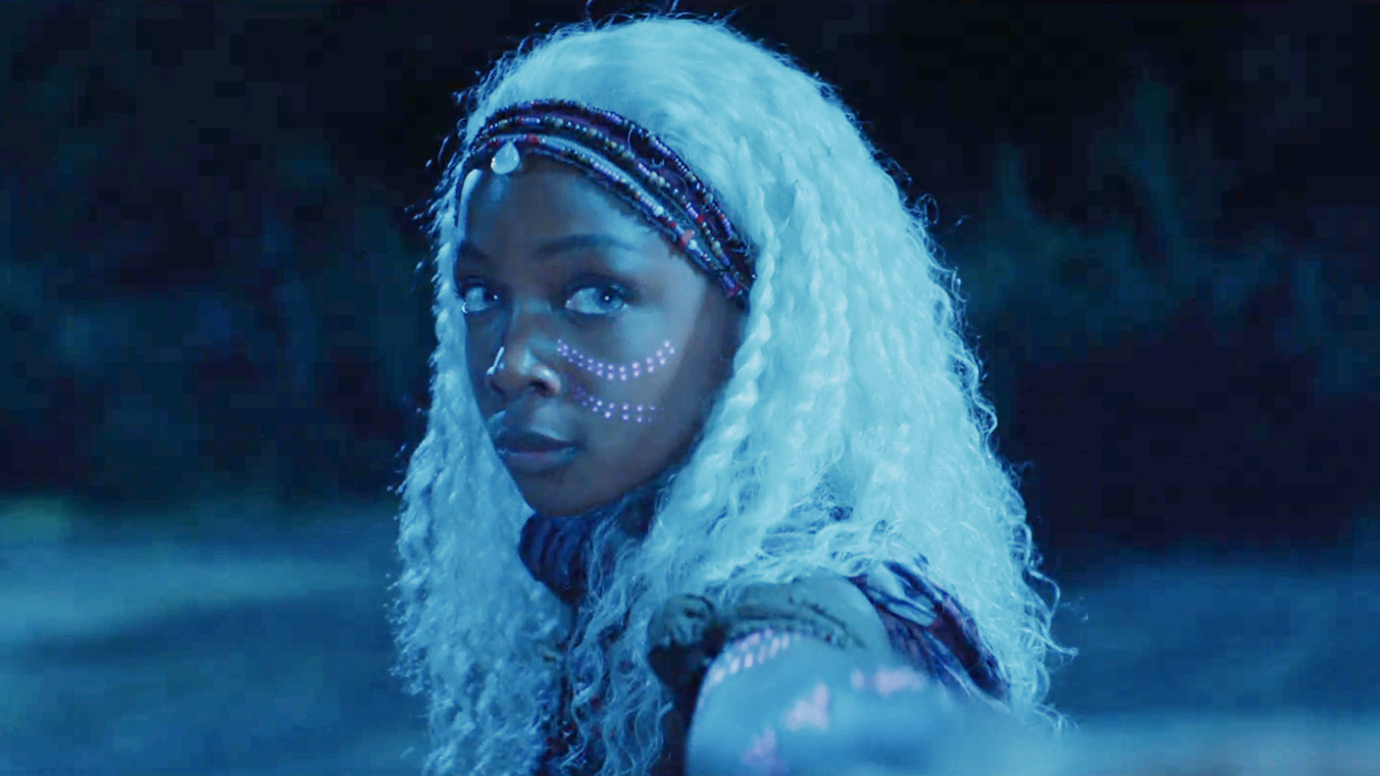 Zelie (Mbedu) , a woman with the power to command undead spirits in her homeland, the kingdom of Orisha, Children of Blood and Bone (2027).