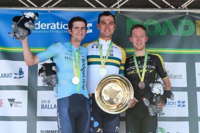 Team BridgeLane&#039;s Chris Harper (left) acknowledges the crowd support after taking second place at the 2019 Australian road race national championships