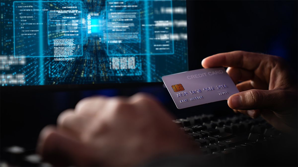 Image of person holding credit card