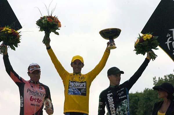 The top three with flowers on the podium.
