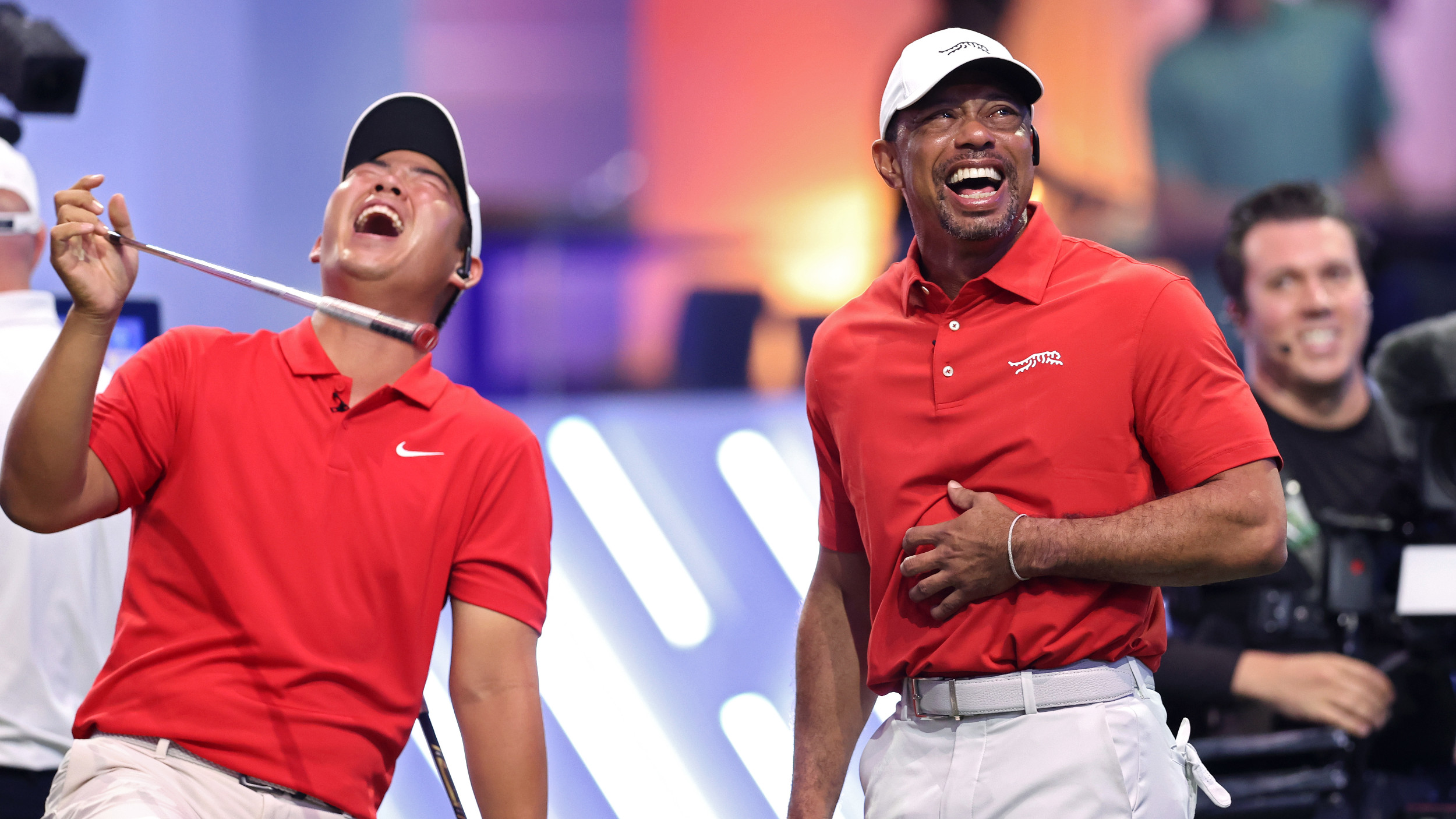 Tom Kim and Tiger Woods celebrate a victory at TGL in Florida.