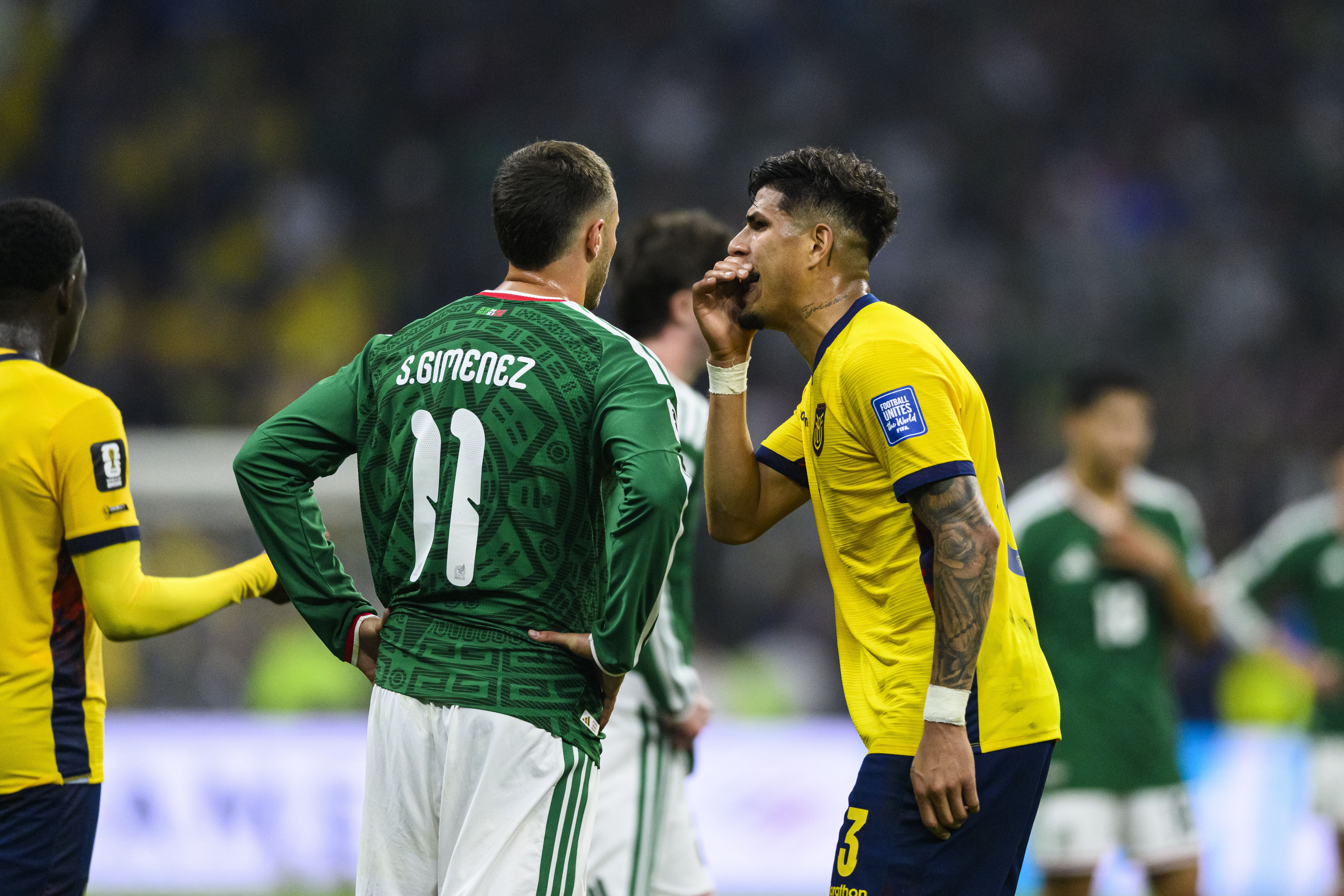 MEXICO CITY, MEXICO - JUNE 30: Piero Hincapie of Ecuador (R) covers his mouth while arguing with Santiago Gimenez of Mexico (L) during the FIFA World Cup 2026 Round Of 32 match between Mexico and Ecuador at Mexico City Stadium on June 30, 2026 in Mexico City, Mexico. (Photo by Mart&iacute;n Fonseca/Eurasia Sport Images/Getty Images)
