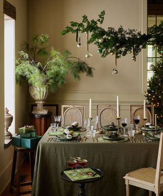 Christmas table styled with natural foliage and green decorations and accessories from Hestia Living