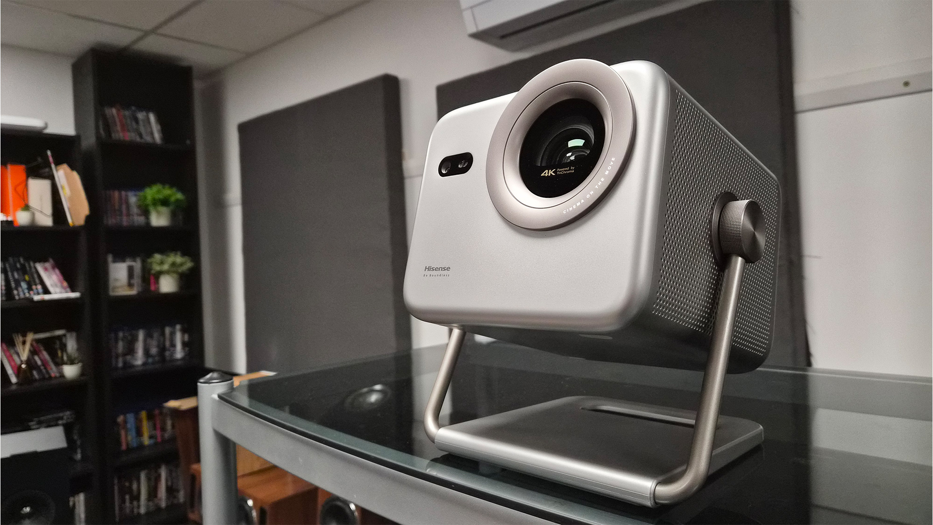 Hisense M2 Pro lifestyle projector on glass table in test room