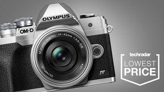 The Olympus OM-D E-M10 Mark IV on a grey background