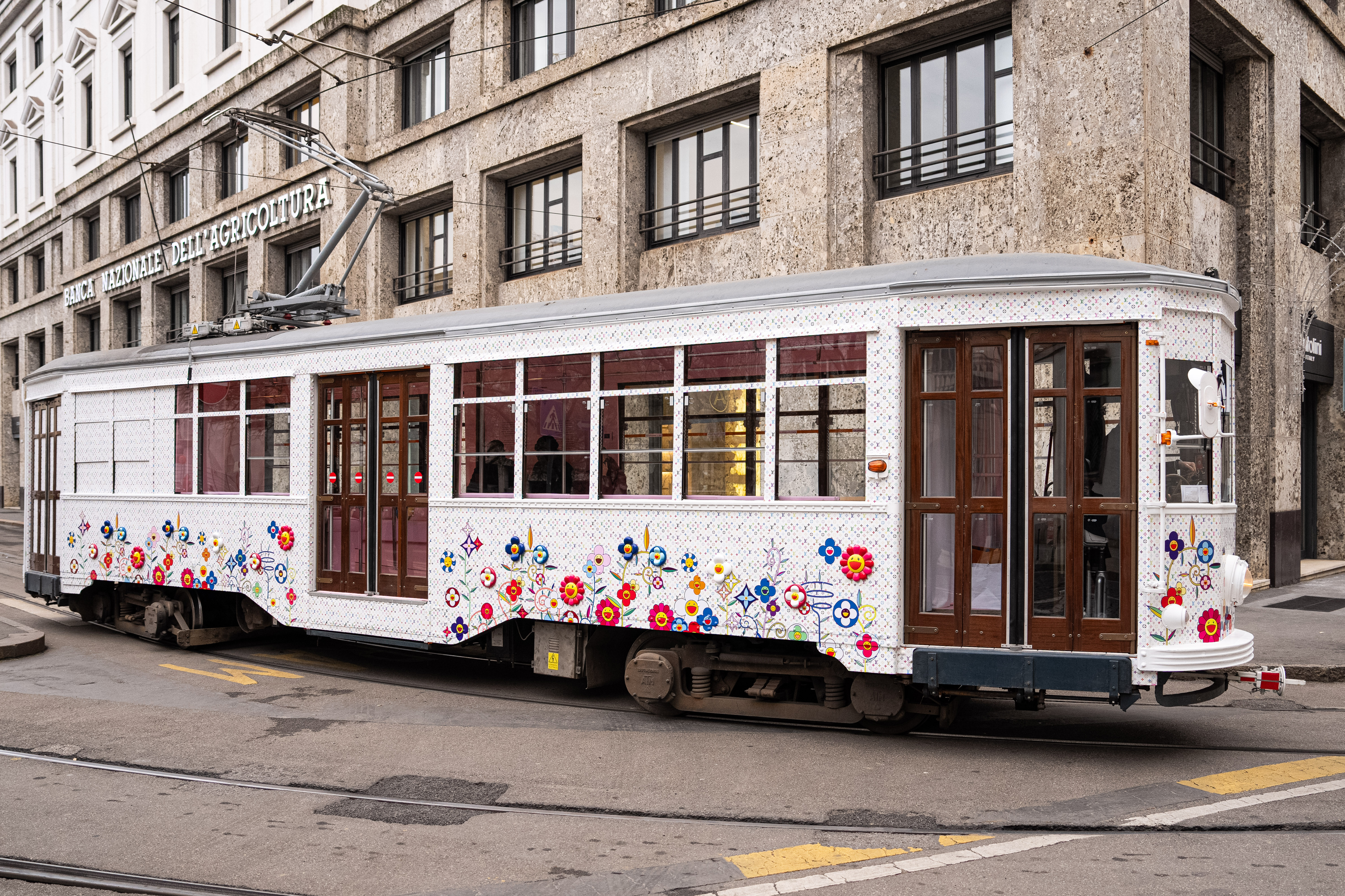 MILAN, ITALY - JANUARY 11: a historic Milanese tram customized by the fashion brand Louis Vuitton on January 11, 2025 in Milan, Italy. To celebrate 20 years of partnership with artist Takashi Murakami, fashion brand Louis Vuitton has converted two of the city&#039;s historic trams: one into a cinema and one into a caf&amp;eacute; for breakfast and snacks like in Tokyo. (Photo by Alessandro Levati/Getty Images)