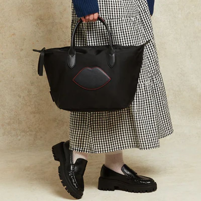 BLACK NYLON OH LU LU MEDIUM TOTE BAG carried by model