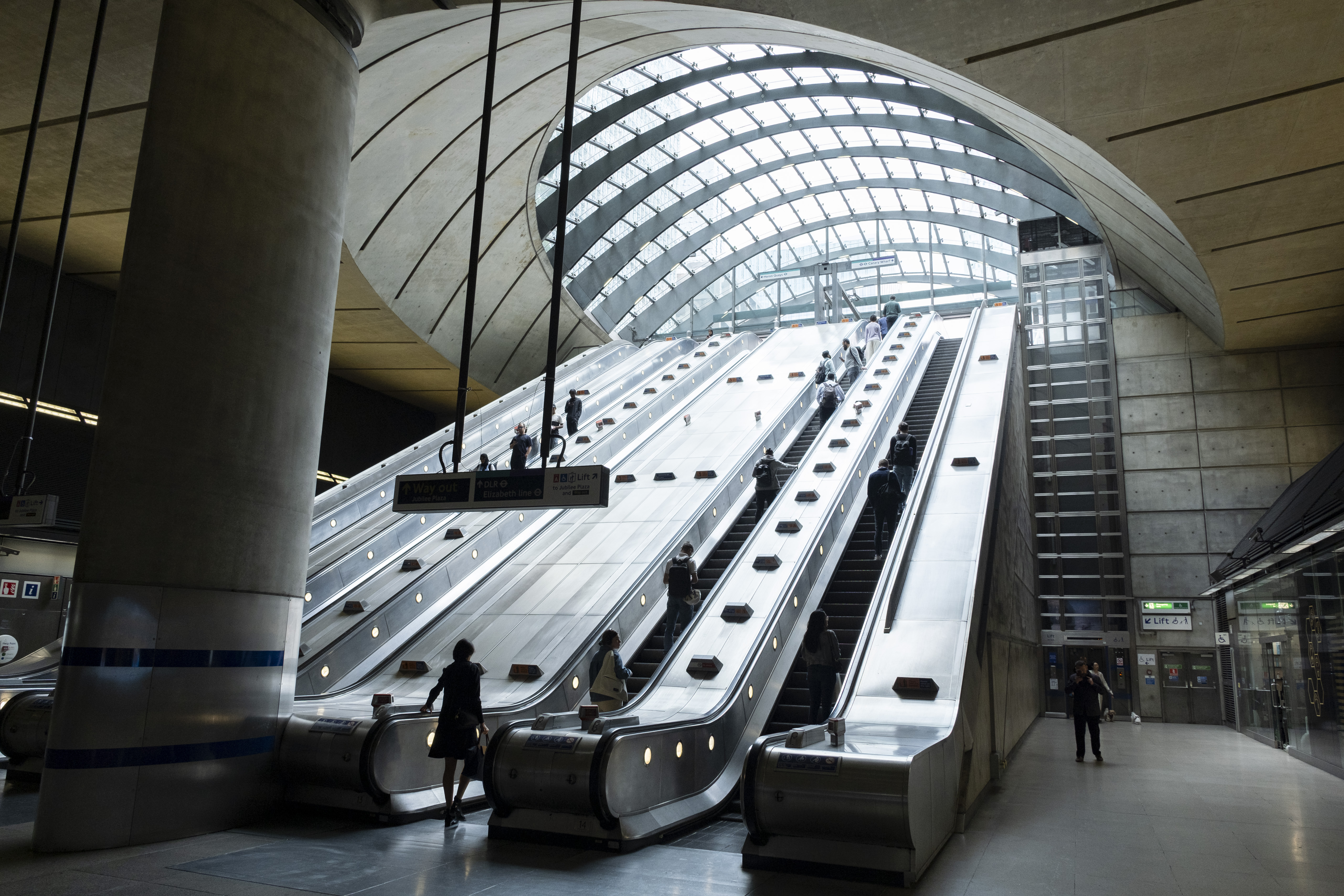 Entrance to Canary Wharf Underground Station, this grand entrance fits the location at the heart of Canary Wharf financial district on 1st July 2024 in London, United Kingdom. Canary Wharf is an area located near the Isle of Dogs in the London Borough of Tower Hamlets and is defined by the Greater London Authority as being part of London&#039;s central business district. Along with the City of London, it constitutes one of the main financial centres in the United Kingdom and the world, containing many high-rise buildings including the third-tallest in the UK.