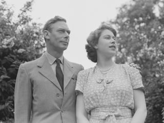 King George VI and Queen Elizabeth in the gardens at Windsor Castle, England on July 8, 1946
