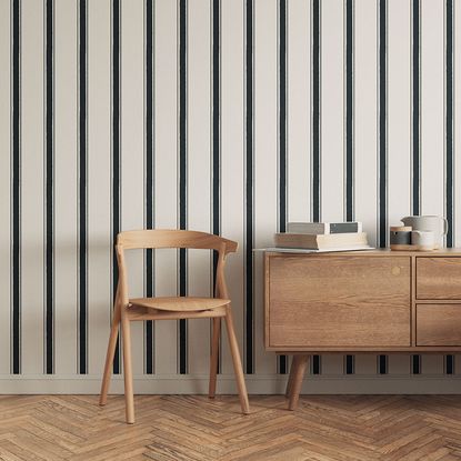 living area with stripped wallpaper and sideboard