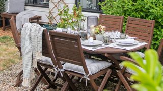 picture of wooden table and chairs set in garden