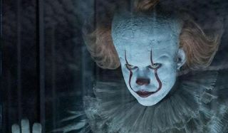 IT Chapter Two Pennywise scowling behind funhouse glass