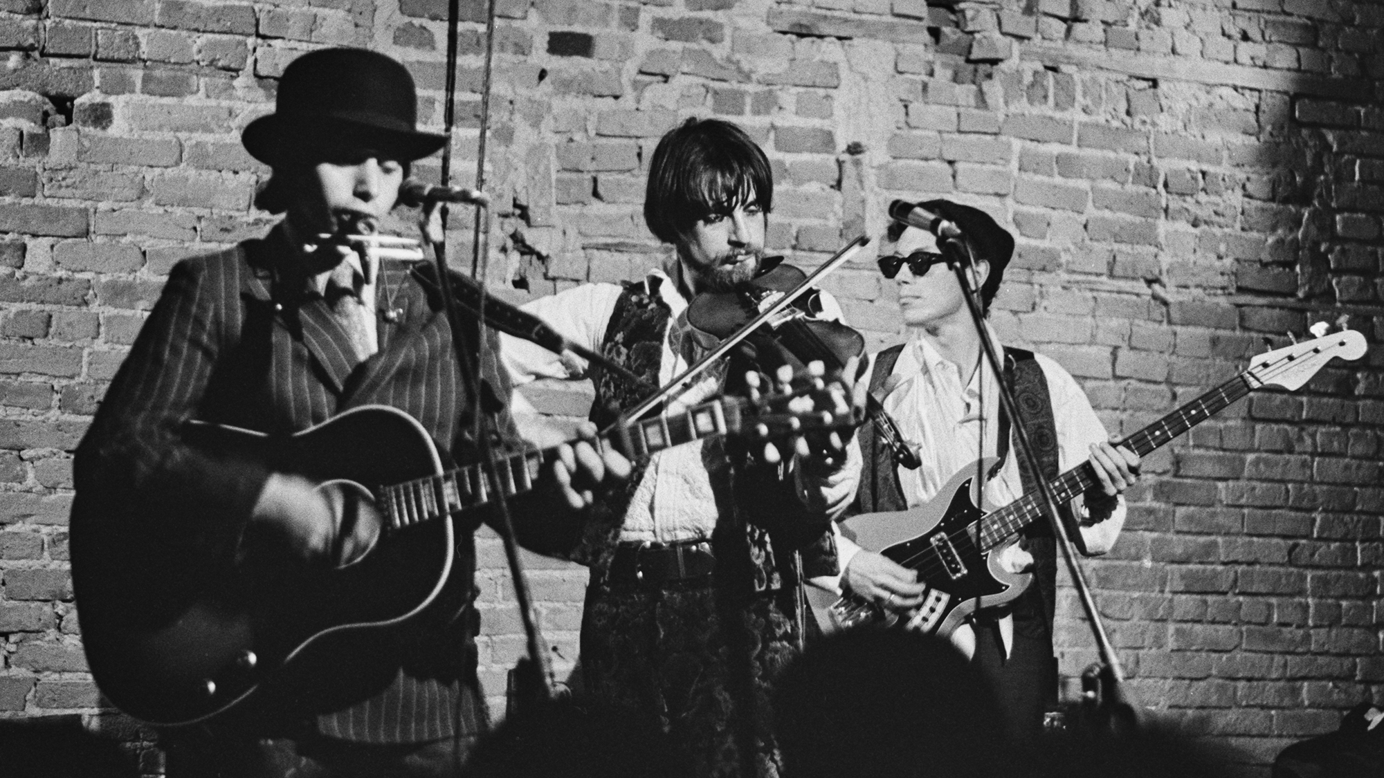 American rock band Dr West's Medicine Show and Junk Band (American singer-​songwriter Norman Greenbaum, American musician Jack Carrington, and American bass player Evan Engber) perform live on stage, location unspecified, April 1967. The band's singer, Bonnie Zee Wallach, is out of shot. Greenbaum would have a 1969 hit as a solo artist with "Spirit in the Sky."