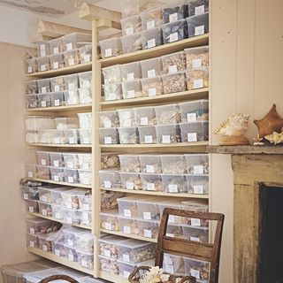 wooden walls with wooden shelves and plastic container