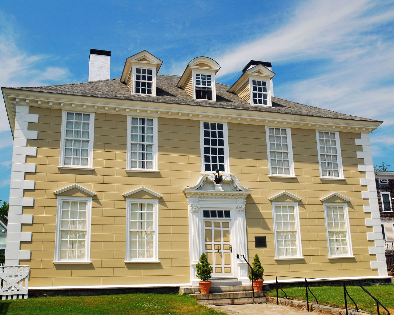 yellow and white georgian brick house exterior