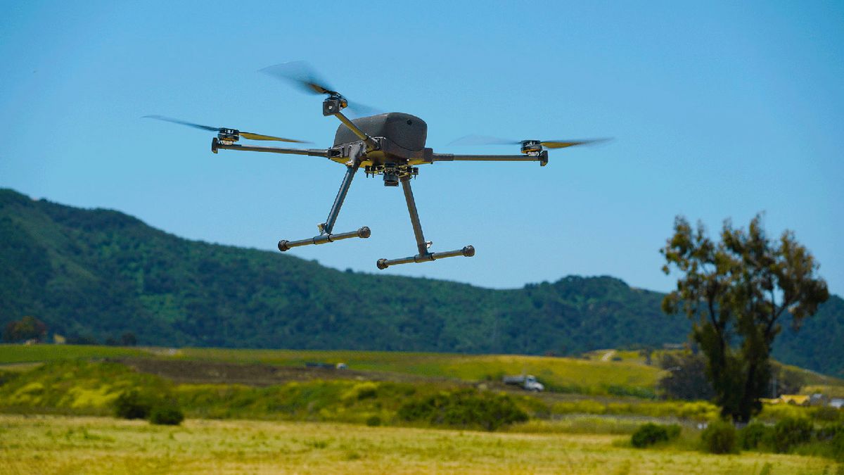 IF800 Tomcat drone in flight over fields with blue sky