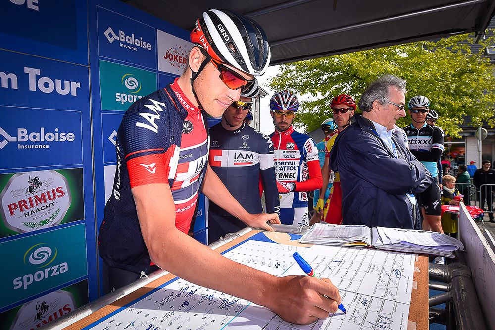 Riders sign in before the final stage in Belgium.