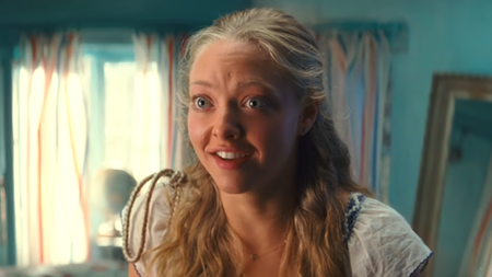 Amanda Seyfried smiling in excitement in Mamma Mia!