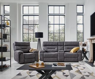grey sofas in living room with large black framed windows