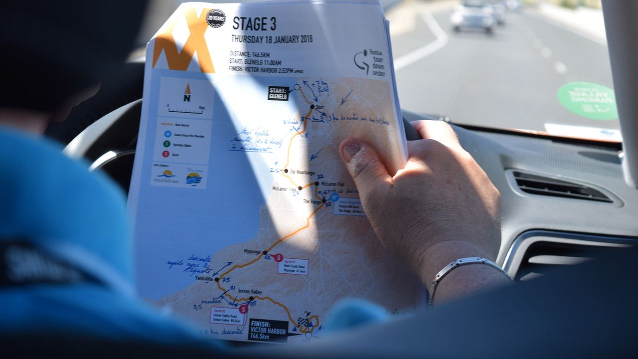 Laurent Biondi checks his race notes during the stage