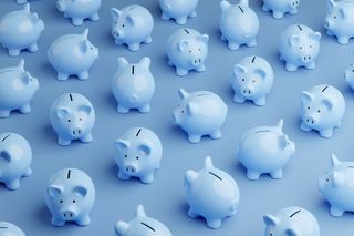 Blue piggy banks against blue background