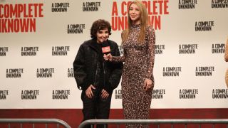 Chloe Fineman being interviewed by Heidi Gardner during a red carpet sketch on SNL.