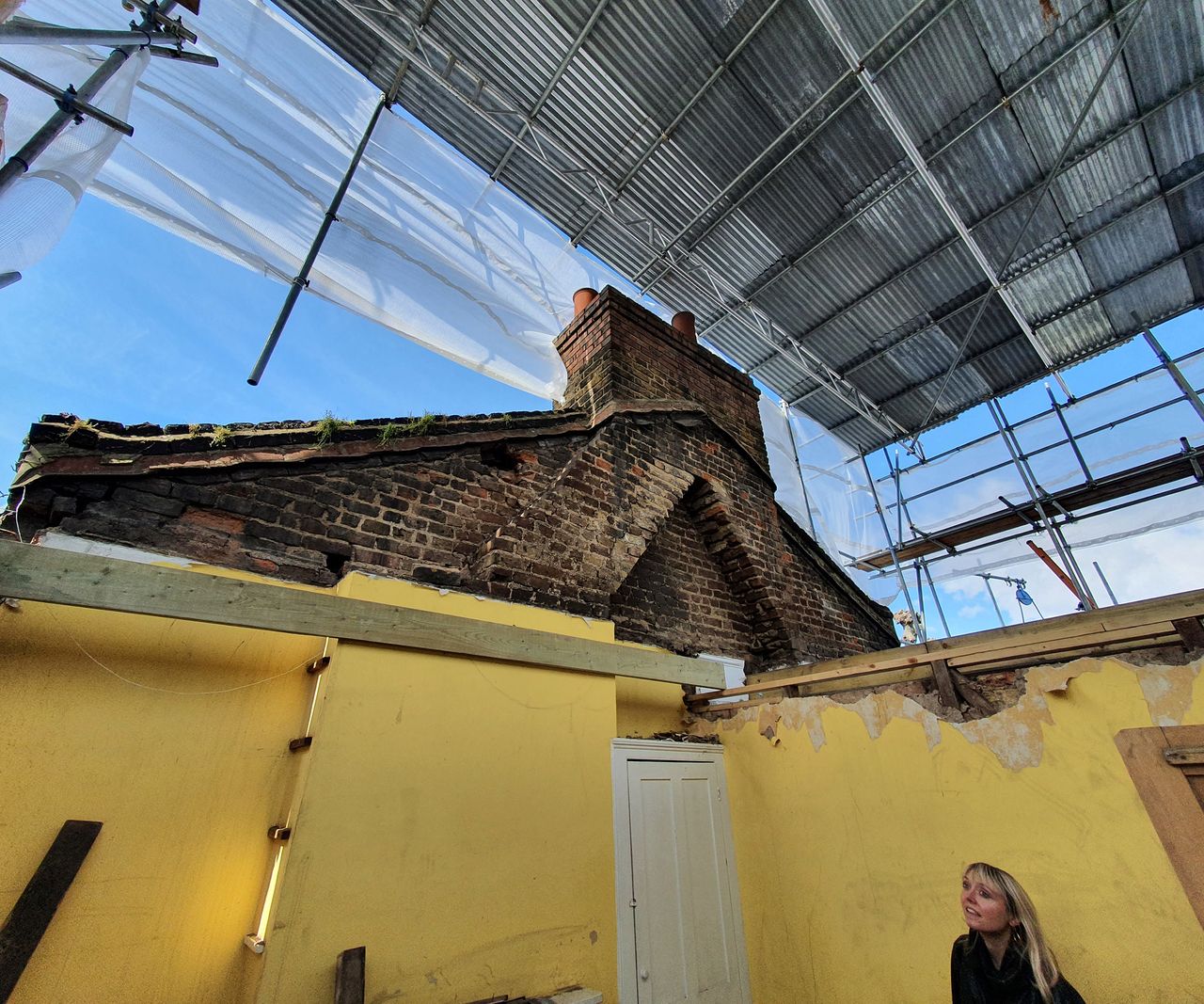 progress pics of a loft conversion with a "scaffolding hat" to protect the build from advers weather